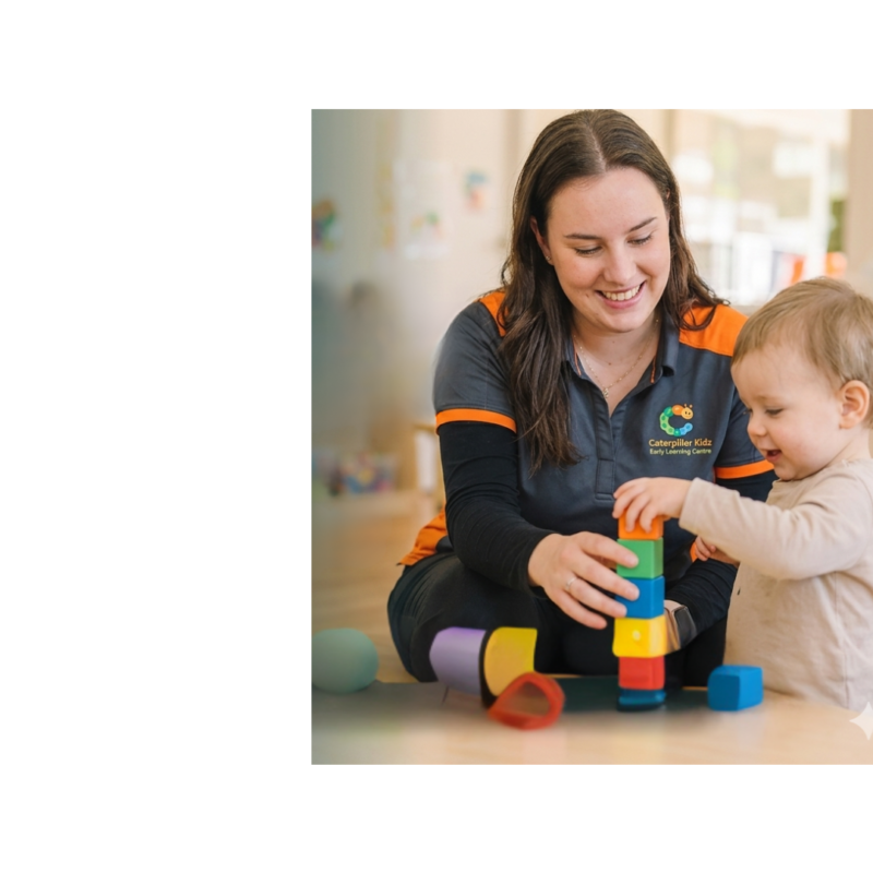Educator and young child building a colourful tower together